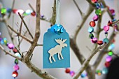 Hand-made paper gift tag with moose motif