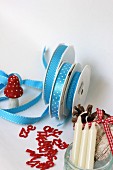 Craft utensils & decorations: ribbons, decorative numbers, toadstool ornament, pine cones & candles