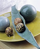 Oriental-style decoration ideas: balls, fruit and a leaf on a flat dish