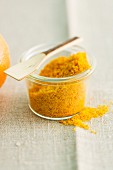 A jar of orange powder