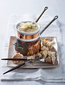 Four cheese fondue with grated Parmesan and croutons