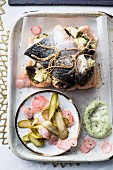 Salmon trout pesto bake with dill mayonnaise and gherkins