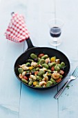 Olive gnocchi with prawns and cherry tomatoes