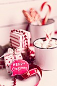 Speech bubble reading 'Merry Christmas', sweeties and red and white gift box