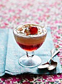 Trifle with glace cherries and flaked almonds