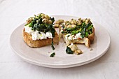 A rustic sandwich with fava beans, spinach and ricotta
