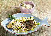 Risotto with fried trout fillet