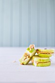 Nut butter and grated coconut sandwiches made with apple slices