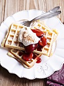 Waffles with plum compote and whipped cream