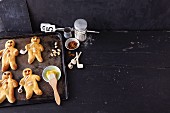 Bread men with almonds on a baking tray