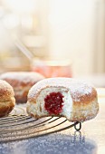 Jam doughnuts on a wire rack