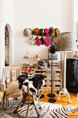 Various animal prints on table made from antlers, lampshade and rug