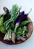 Exotic vegetables in a wooden bowl