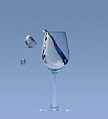 A white wine glass with a splash on a blue background