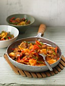 Sweet-and-sour pork with peppers and pineapples