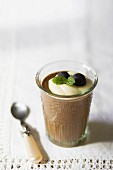 Chocolate mousse with cream, fresh mint and grapes