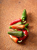 Various different coloured chilli peppers