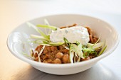 Chickpea salad with tzatziki and spring onions