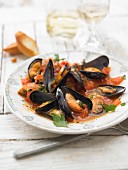 Mussels buzzara with breadcrumbs and tomatoes