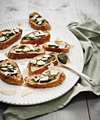 Grilled bread with basil pesto and Parmesan cheese