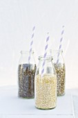 Chia, sunflower seeds and quinoa in milk bottles