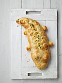 Minced meat wrapped in pastry in the shape of a crocodile