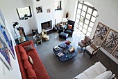 View down into eclectic living area in renovated country house modern ambiance