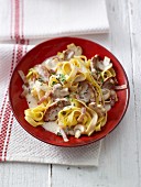 Tagliatelle with pork fillet, mushrooms and bacon