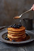 Pancakes with blueberries and maple syrup