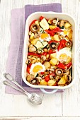 Oven-baked, eggs with potatoes, courgettes, mushrooms and peppers