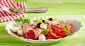 Italian tomato salad with mini mozzarella and salami