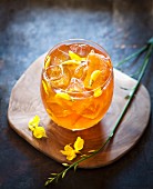 Honeybush iced tea with lemon and honeybush flowers