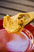 Miso butter on a wooden spoon