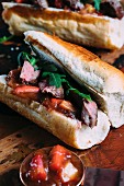 Saddle of venison with rhubarb chutney on a baguette