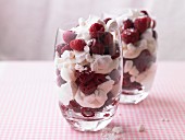 A dessert made with frozen berries, meringue and cream
