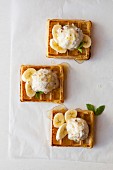 Waffles with coconut and almond ice cream and banana slices