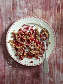 Vegan breakfast rice with pomegranate seeds