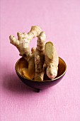 Fresh root ginger in a dish