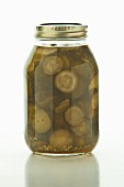 Homemade pickles in a screw-top jar