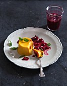 Vegan pumpkin panna cotta with lingonberry compote