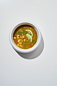 Aguadito de pollo (chicken soup with rice, vegetables and Peruvian spices in a citrus-herb broth)