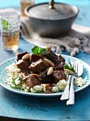 Beef tagine with almonds and baked plums