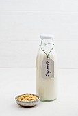 Soya milk in a glass bottle with a label