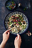 White bean salad, pomegranate seeds, olives and mint (Turkey)