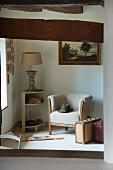 Armchair, corner side table and vintage suitcases