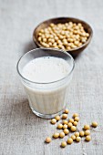 A glass of soya milk and a soya beans
