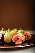 Fresh figs on a brown plate