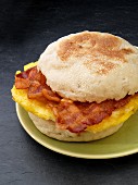 An English muffin with bacon and scrambled egg (USA)