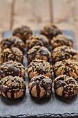 Polvorones (Spanish biscuits) with chocolate glaze and sesame seeds