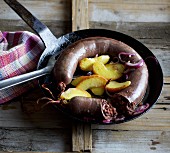 Homemade French black pudding with fried apple wedges